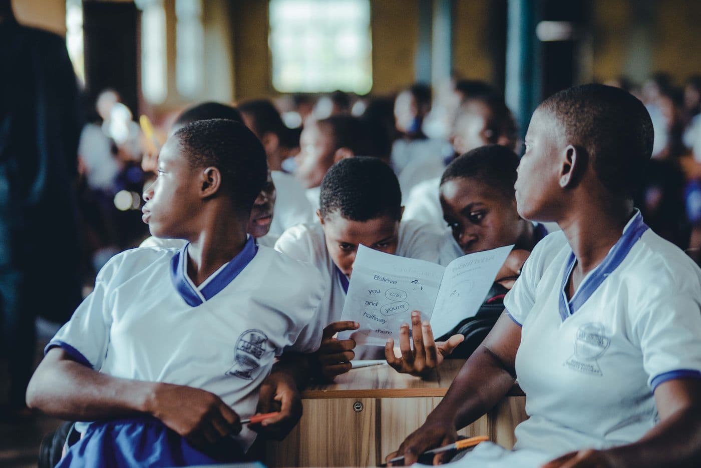 Students collaborating on a learning assignment in a Ugandan classroom